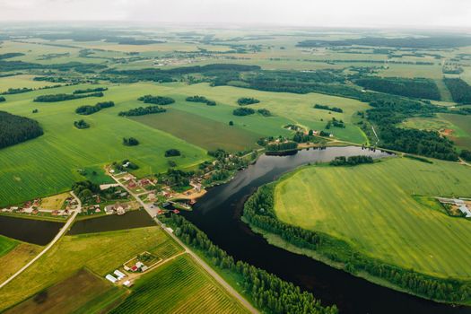 view from the height of the Lake in a green field in the form of a horseshoe and a village in the Mogilev region.Belarus.The Nature Of Belarus.