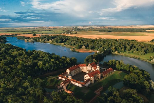 Aerial photo Nesvizh castle in autumn evening, Belarus Minsk, top view.