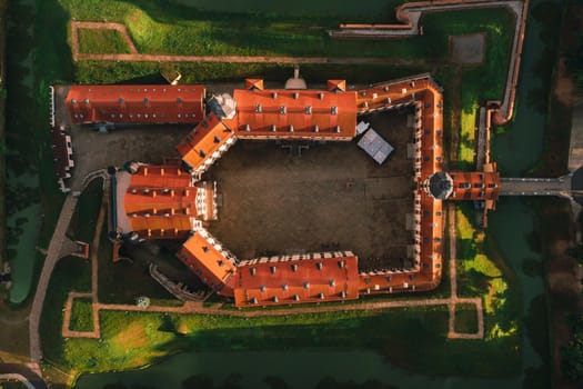 Aerial photo Nesvizh castle in autumn evening, Belarus Minsk, top view.