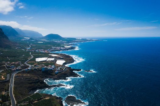 Rocky cliff and road along the island of Tenerife, Canary Islands, Spain.Bird's eye view of the coast near Garachico in the Canary Islands.