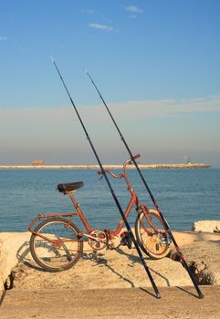 CHIOGGIA, ITALY - JANUARY, 01: Fisher bike with fishing rods on January 01, 2016