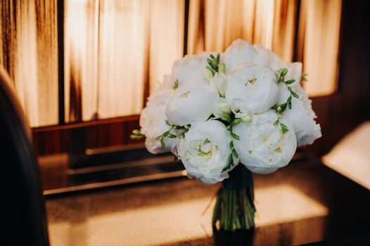 wedding bouquet with peonies at the wedding.Beautiful bouquet of flowers.