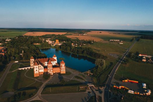 Mir castle with spires near the lake top view in Belarus near the city of Mir.