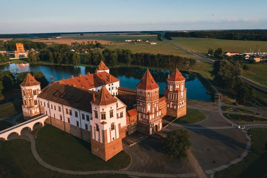 Mir castle with spires near the lake top view in Belarus near the city of Mir.