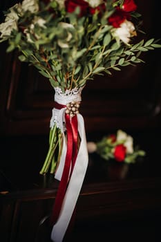 wedding bouquet with roses and boutonniere.The decor at the wedding.