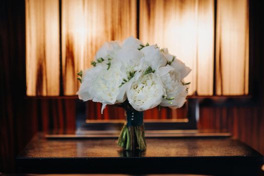 wedding bouquet with peonies at the wedding.Beautiful bouquet of flowers.