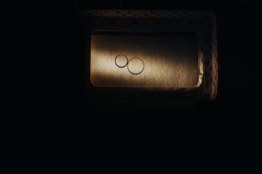 Close-up of two gold wedding rings for a wedding.