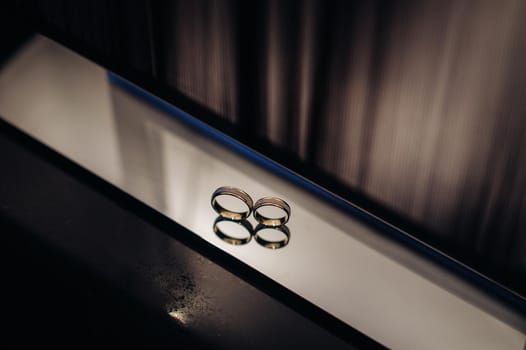 Close-up of two gold wedding rings for a wedding.