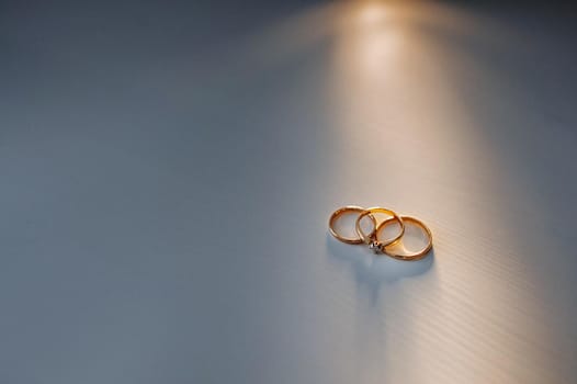 Close-up of two gold wedding rings for a wedding.