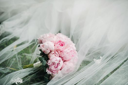 wedding bouquet with peonies at the wedding.Beautiful bouquet of flowers.