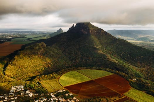 Aerial view of mountains and fields in Mauritius island.