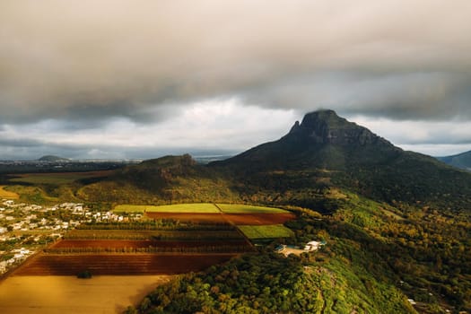 Aerial view of mountains and fields in Mauritius island.