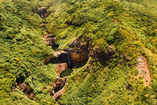 Aerial top view perspective of Tamarin Waterfall Seven Cascades in the tropical island jungle of Mauritius