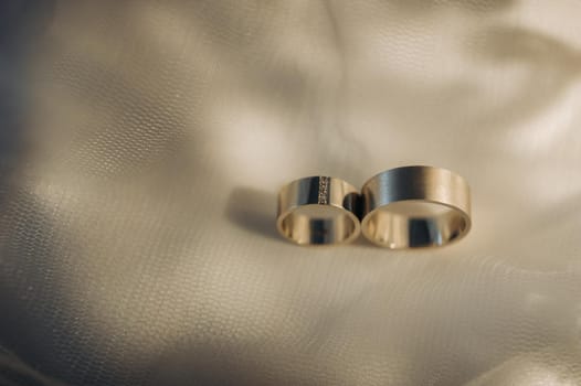 Close-up of two gold wedding rings for a wedding.