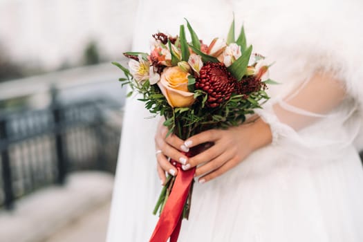 wedding bouquet in the hands of the bride.The decor at the wedding.