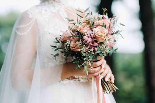 wedding bouquet in the hands of the bride.The decor at the wedding.