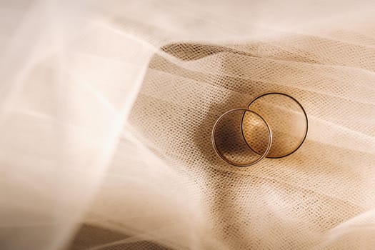 Close-up of two gold wedding rings for a wedding.