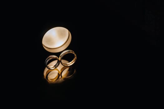 Close-up of two gold wedding rings for a wedding.