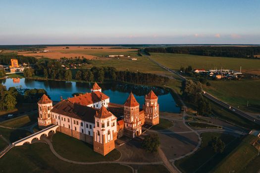 Mir castle with spires near the lake top view in Belarus near the city of Mir.