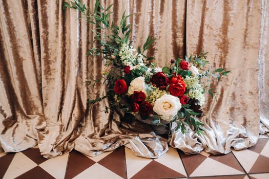 wedding table decoration with flowers on the table in the castle, table decor for dinner by candlelight.Dinner with candles.