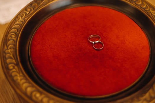 Close-up of two gold wedding rings for a wedding.