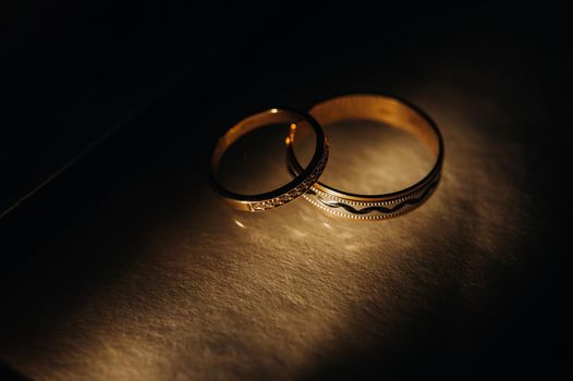 Close-up of two gold wedding rings for a wedding.