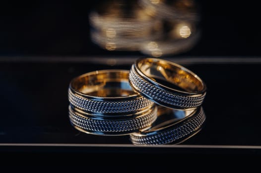 Close-up of two gold wedding rings for a wedding.