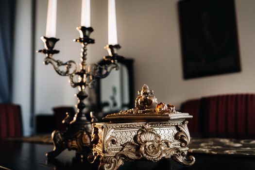 Gold wedding rings lie on an antique jewelry box. Wedding rings for ceremonies.