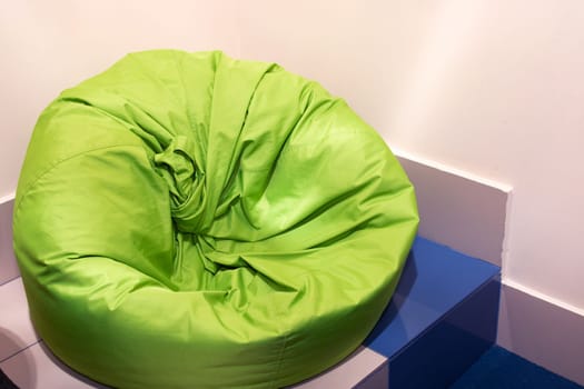 Green bean bag chair in the room close up