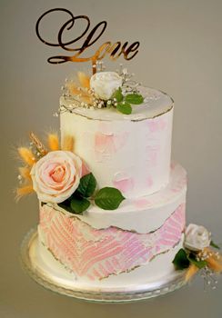 wedding bunk cake decorated with fresh flowers on a dark background