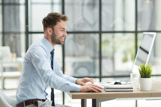 Young businessman working at office