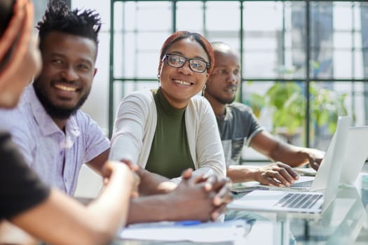 african business people handshaking at modern office