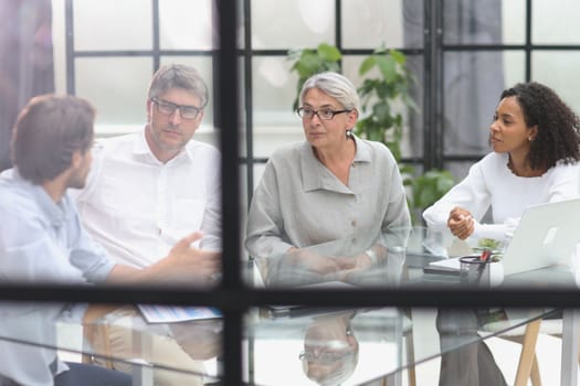 discussion of business people in the office sitting at the table