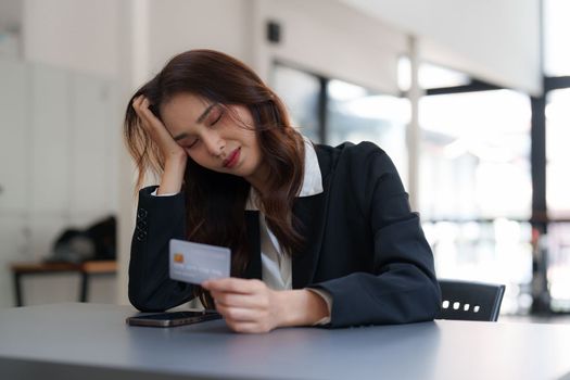 Woman makes a purchase on the smart phone with credit card, online payment, shopping online, e-commerce, internet banking concept.