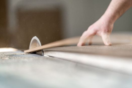 cutting laminate for the production of furniture on a circular saw.