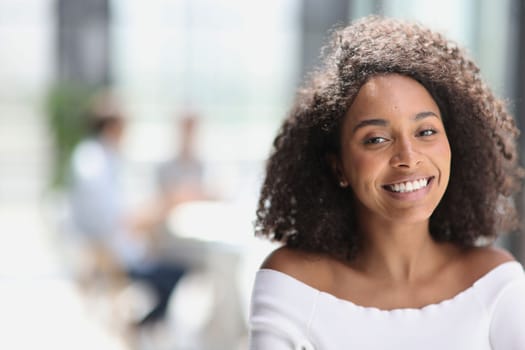 Portrait of an African American young business woman working in the office