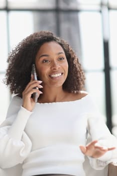 Portrait of a young African American woman using a smartphone