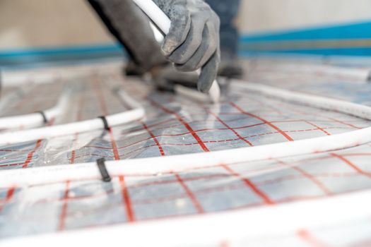 underfloor heating in the room on the construction site.