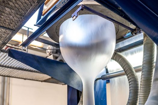 blowing plastic on a machine into a roll for the production of plastic bags.