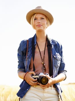 Fascinated by nature. an attractive young woman outdoors on a summer day