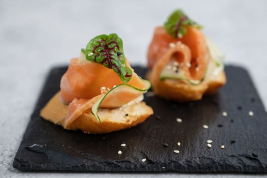 Sandwich with bread salmon slices and soft cheese