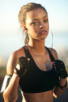 Im ready to rumble. a young woman exercising outdoors