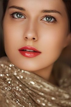 Beauty, luxury fashion and glamour, beautiful woman dressed in gold, portrait