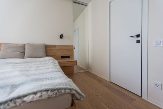 Interior of comfortable modern bedroom.