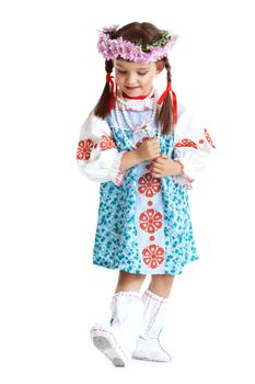 Full length portrait of little girl in slavic costume and wreath of flowers. Isolated on white