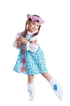 portrait of beautiful little girl in slavic costume and wreath of flowers. Isolated on white