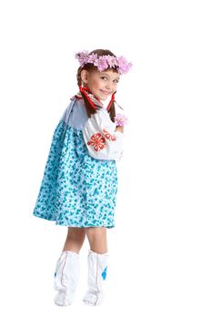 Full length portrait of pretty little girl in slavic costume and wreath of flowers. Isolated on white