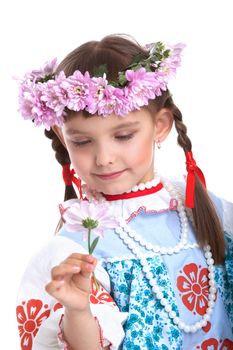 Portrait of little girl in slavic costume and wreath of flowers. Isolated on white