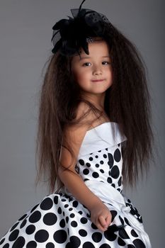 Studio portrait of asian little girl with beautiful hair
