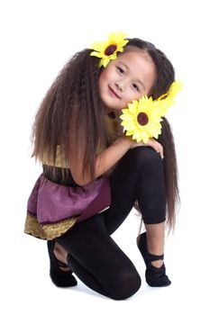 portrait of fashion asian little girl sit on floor with sunflower in head. Isolated on white